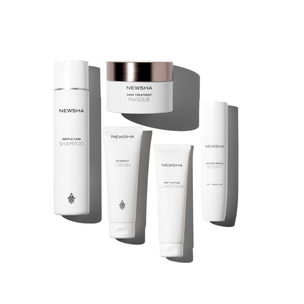 Pflegeset von NEWSHA mit Gentle Care Shampoo, Deep Treatment Masque, Blowout Cream, Soft Cotton Conditioner und Intense Repair Boost für die sanfte Reinigung, intensive Reparatur und geschmeidiges Styling feiner bis normaler Haare.